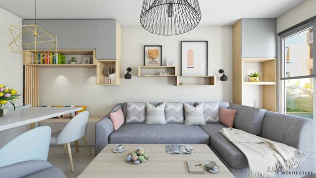 Un espace salon, salle à manger optimisés avec des rangements.