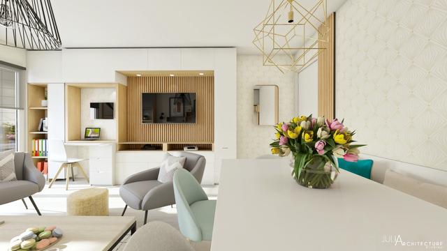 Un espace salon, salle à manger optimisés avec des rangements.