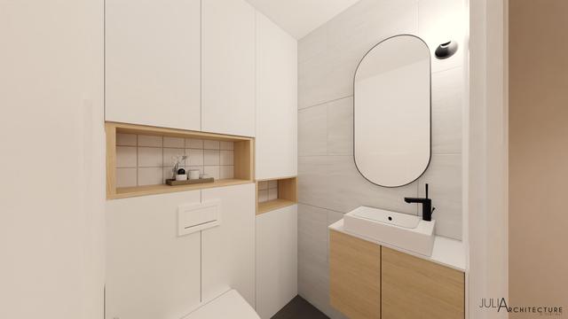 Une pièce lumineuse et agréable avec rangements sur mesure et lave-main.